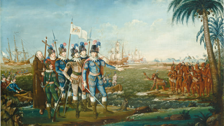 a painting depicting Christopher Columbus meeting the indigenous people on the Americas