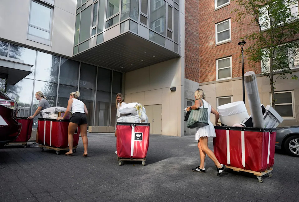 Red rolling bins signal the first day of move-in week at Ohio State University, which this year will begin on Aug. 20.