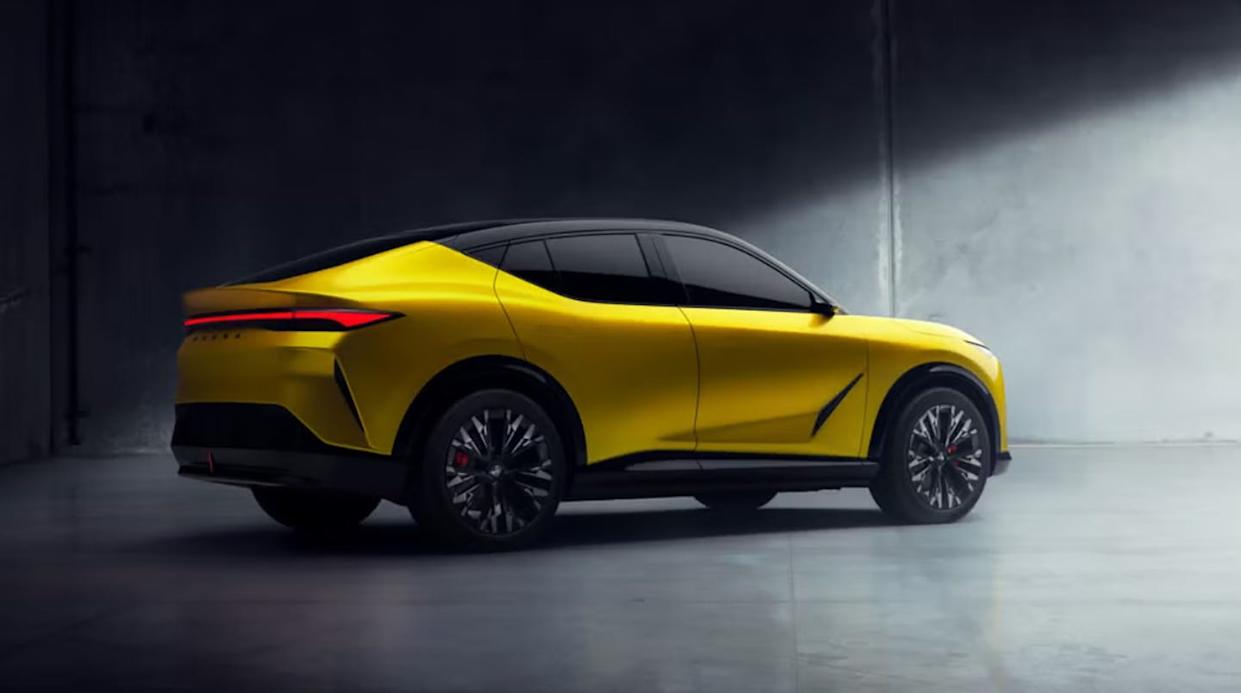sporty yellow suv in a dimly lit industrial setting