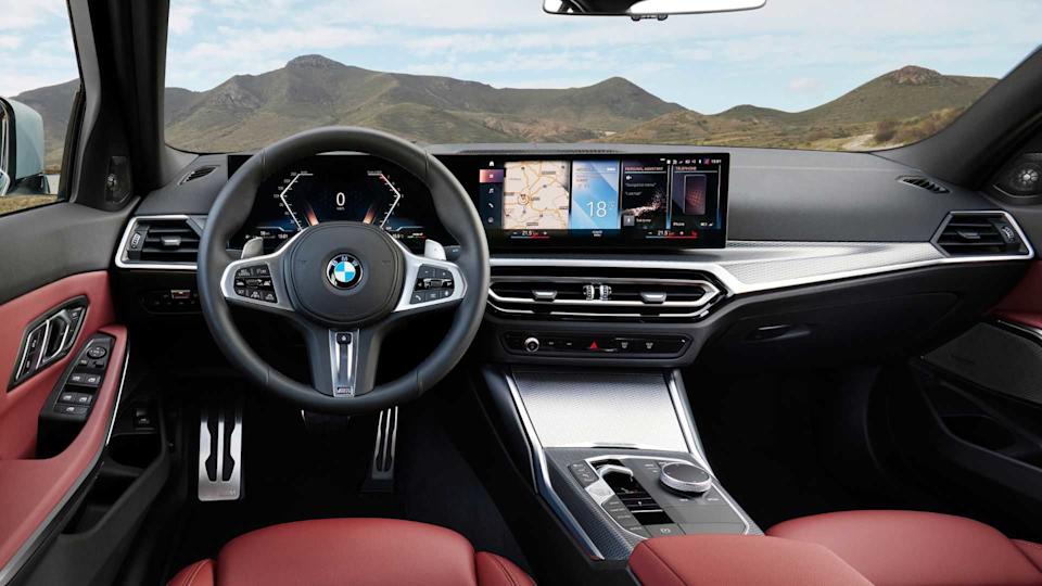 Shot inside the cabin of a 2025 BMW 3-Series showing the front seats and dashboard.