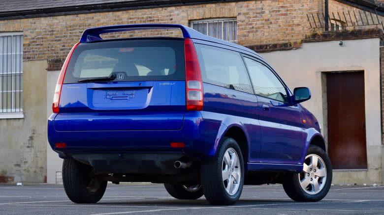 rear three-quarters shot of the blue HR-V in a parking lot