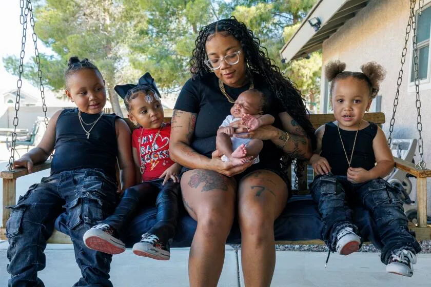 APPLE VALLEY, CA - JULY 25, 2025: Nauzhae&#39; Drake&#39;s children Kewan,6, left, Na&#39;Zaiyla,4, Kailowa, two weeks and Khalan,3, all have the same birthday, July 7, on July 25, 2025 in Apple Valley, California.(Gina Ferazzi / Los Angeles Times)