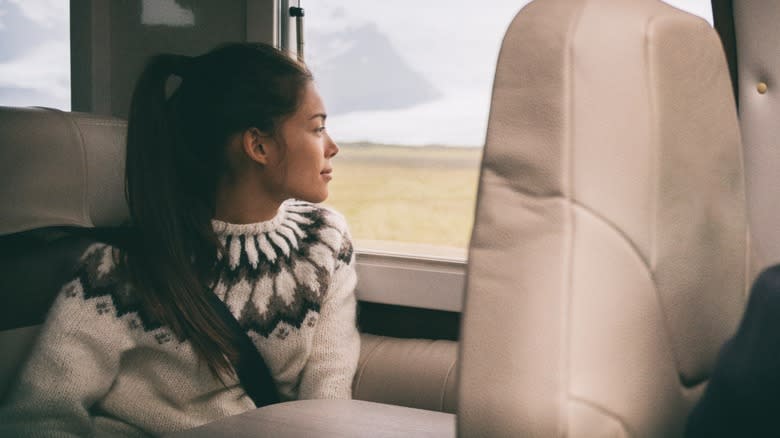 Young female RV passenger wearing seatbelt